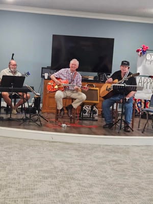 Residents enjoying live music performance in common area