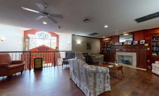 Bright common area with seating and bookshelves