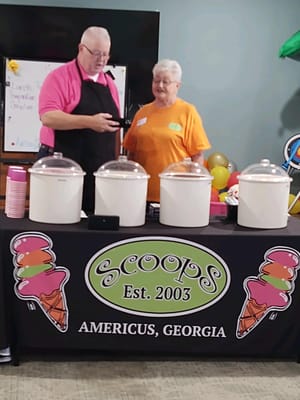 Volunteers serving ice cream at a community event