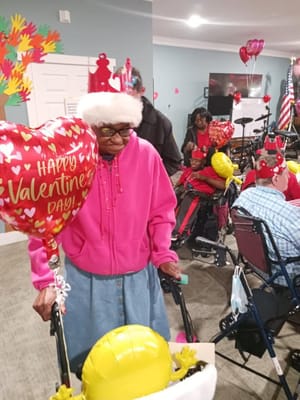 Residents celebrating Valentine's Day with balloons