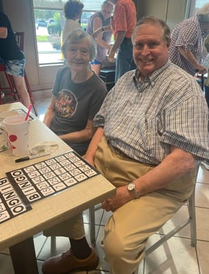 Two residents enjoying a game of bingo