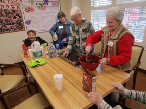 Residents participating in a baking activity together