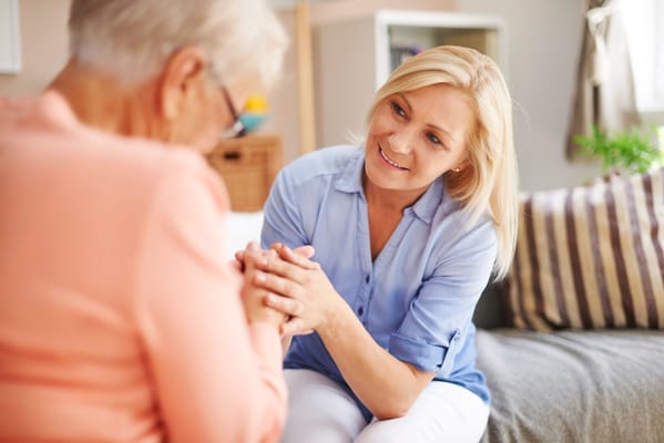 Caregiver engaging warmly with a resident