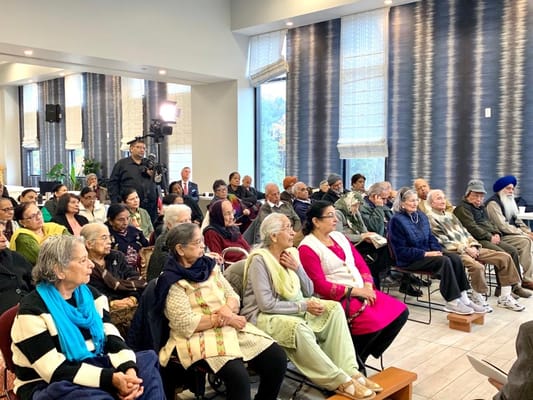 Residents attending an event in a bright common area