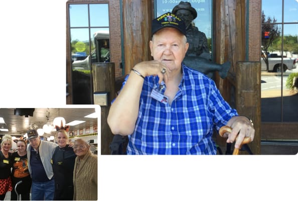 Residents and staff posing together happily