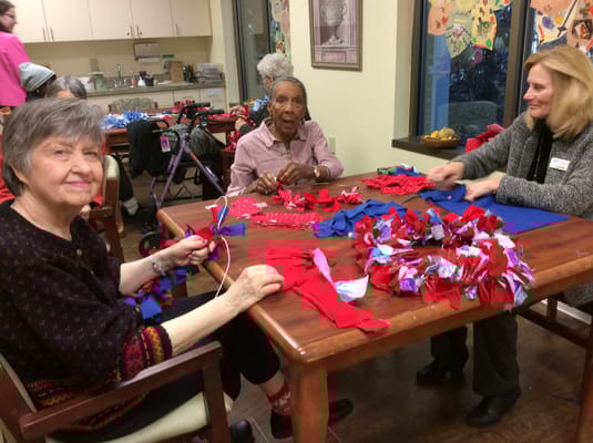 Residents participating in a craft activity together