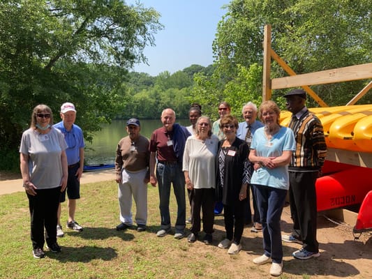 Group of residents by the water enjoying a sunny day