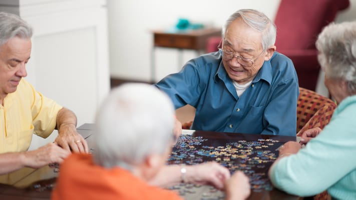 Residents engaging in a jigsaw puzzle activity