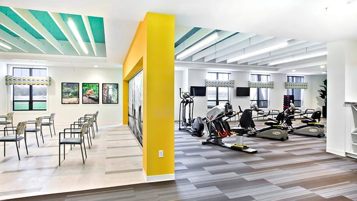 Interior view of a vibrant common area and exercise space