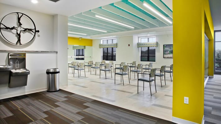 Interior view of a bright common area with chairs