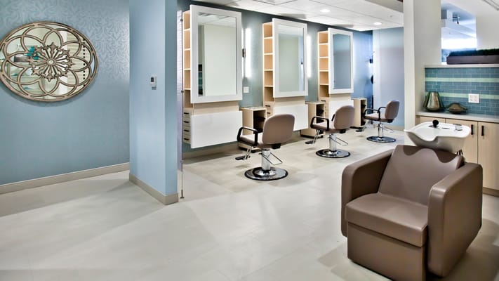 Hair salon interior with styling stations and chairs