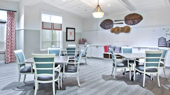 Bright common area with tables and chairs