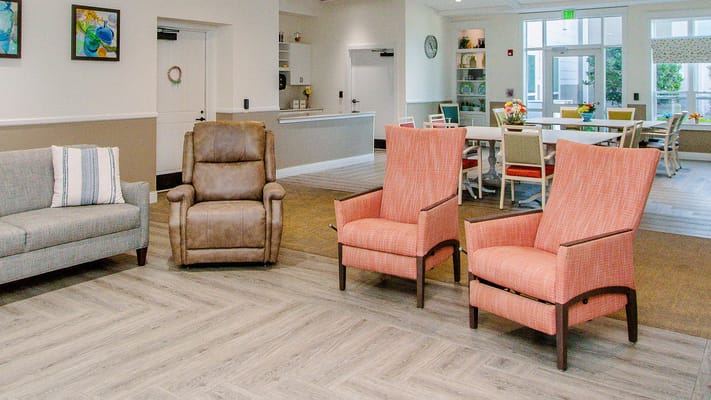 Bright common area with colorful chairs and seating
