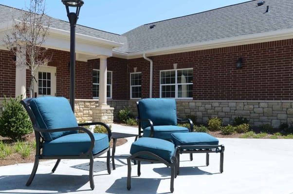 Outdoor seating area with blue chairs
