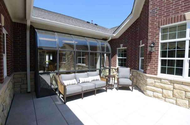 Outdoor seating area with sunroom enclosure