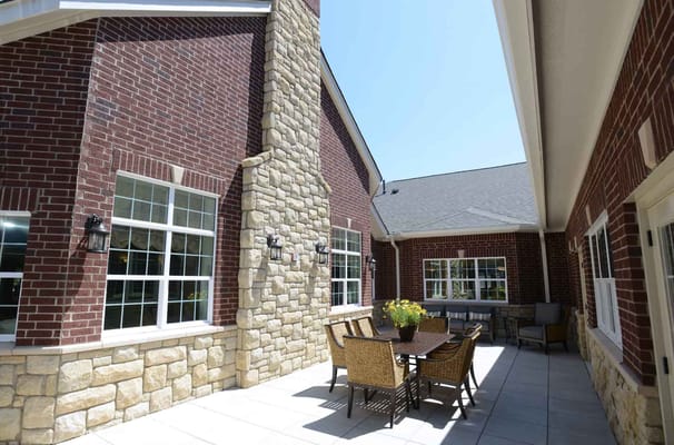 Outdoor seating area with tables and chairs