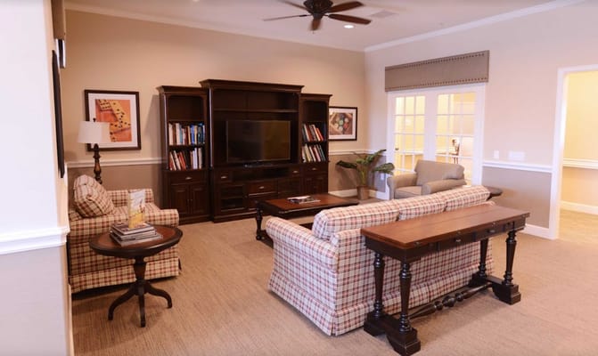 Cozy common area with comfortable seating and a TV.