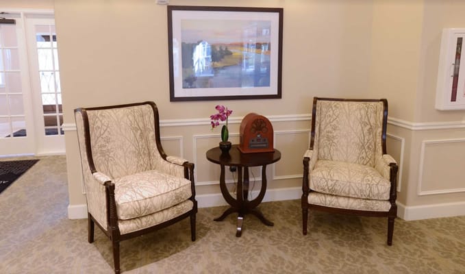 An inviting corner seating area with floral decor