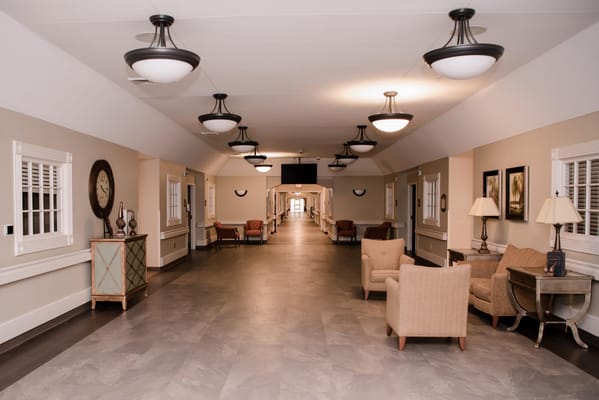 Bright internal corridor with seating areas