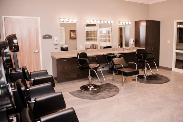 Interior view of a salon with styling chairs and mirrors