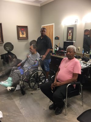 Residents being serviced in a hair salon