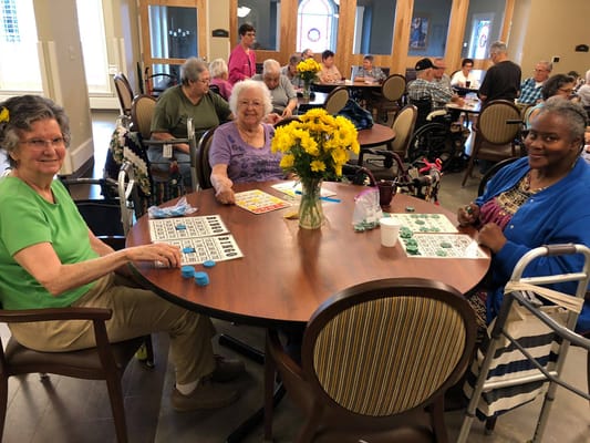 Residents enjoying bingo in a common area