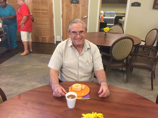 Resident enjoying a snack in the dining area