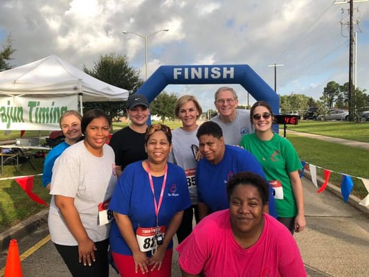 Participants celebrating at a finish line of a race