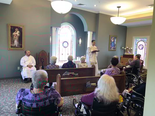 Residents attending a service in a chapel