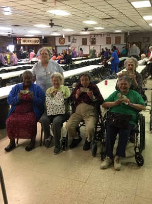 Residents celebrating in a bright common area