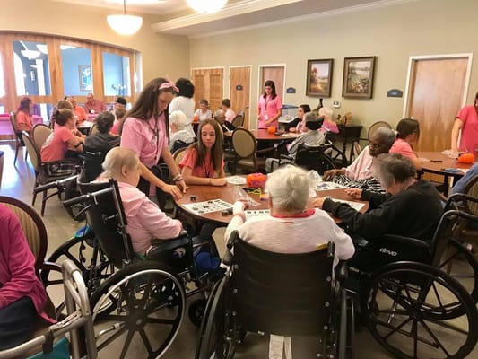 Residents participating in a bingo activity in a communal area