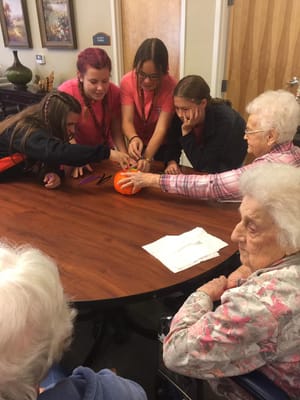 Residents and staff participating in a group activity