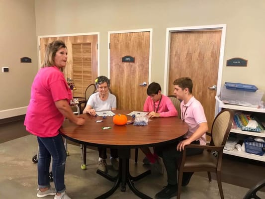 Residents engaging in a group activity with staff