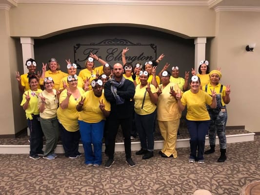 Staff celebration with playful costumes in the common area