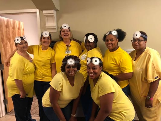 Staff members dressed in fun costumes for an activity