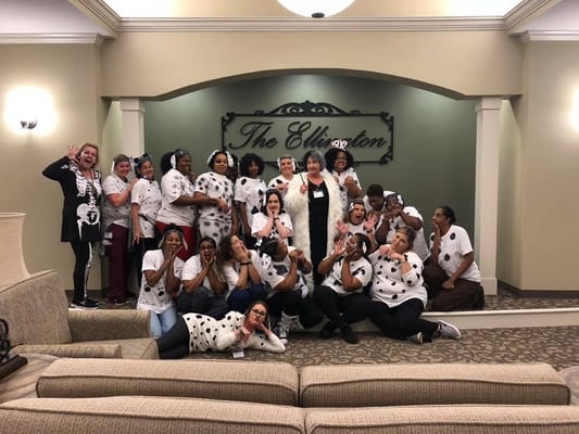 Staff members posing in a celebration at The Ellington