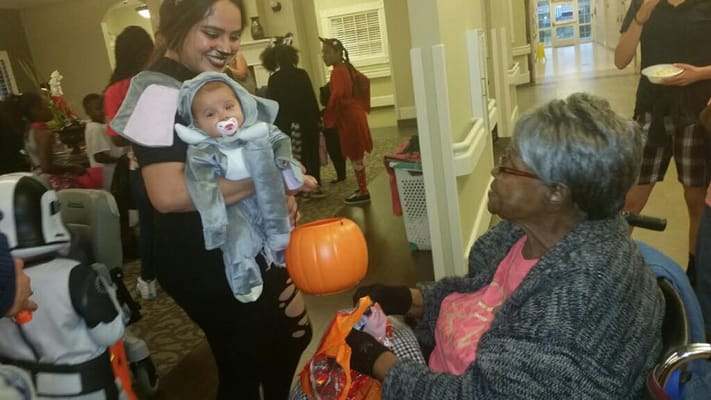 Residents enjoying a Halloween celebration with costumes