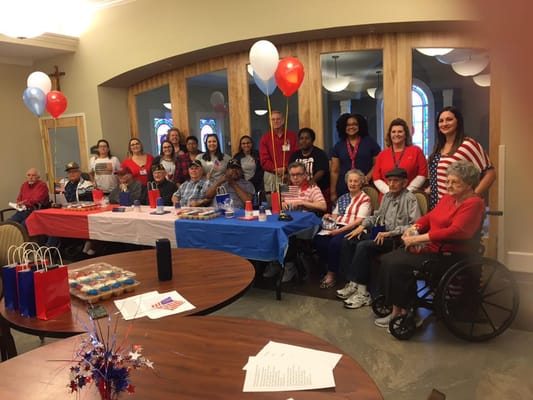 Residents and staff celebrating a festive event with decorations