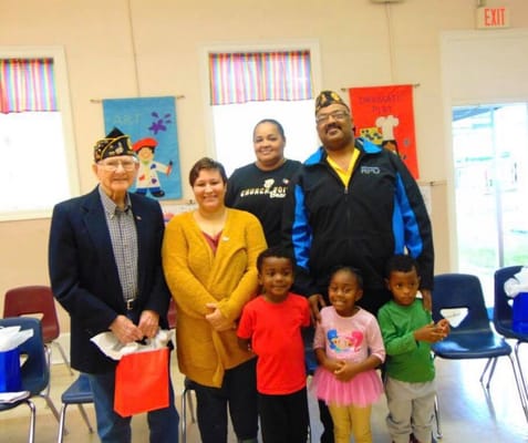 Residents and staff posing in a common area