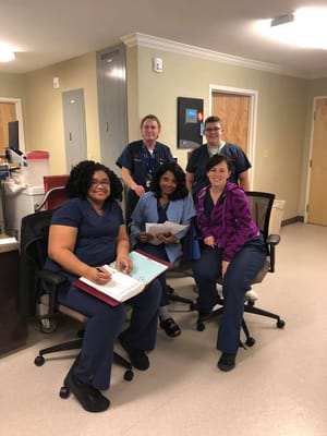 Staff members collaborating in a facility office