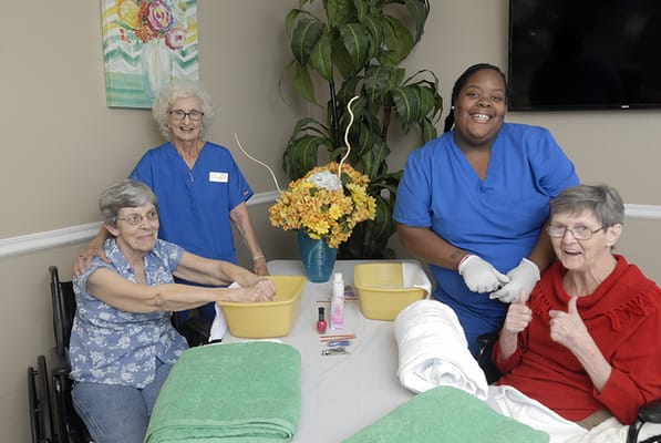 Residents participating in an activity with staff support