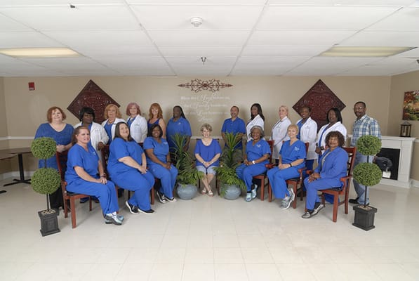 Staff posing in a common area of the facility