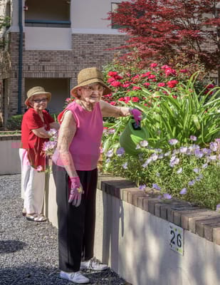 Residents gardening in a vibrant outdoor space