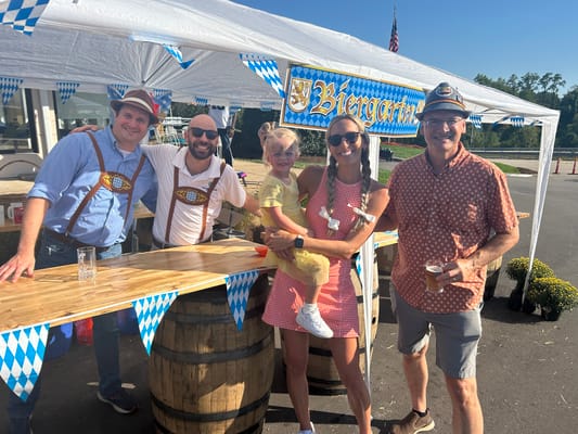 Residents enjoying a community event under a tent