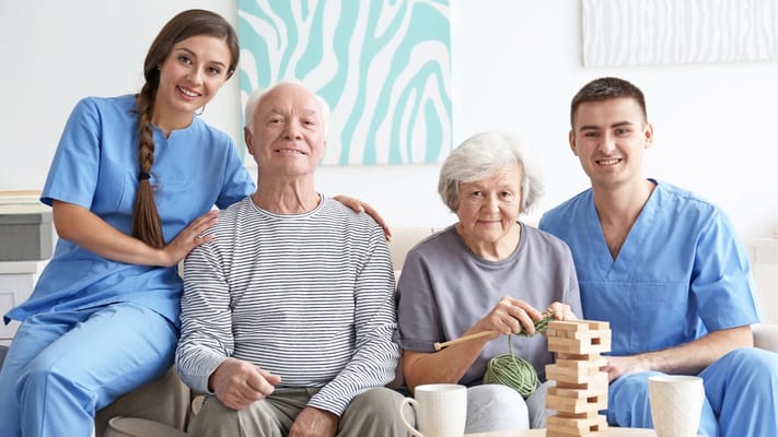 Residents and staff enjoying a group activity indoors