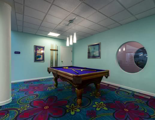 Interior view of a billiards table in an activity room