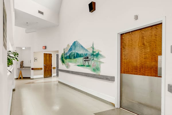 A corridor in the facility with a mural