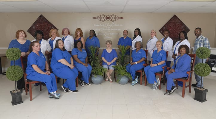 Group of staff members posing in a facility common area
