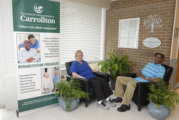 Residents engaging in therapy in a bright room