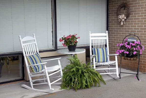 Rocking chairs and flowers on a porch